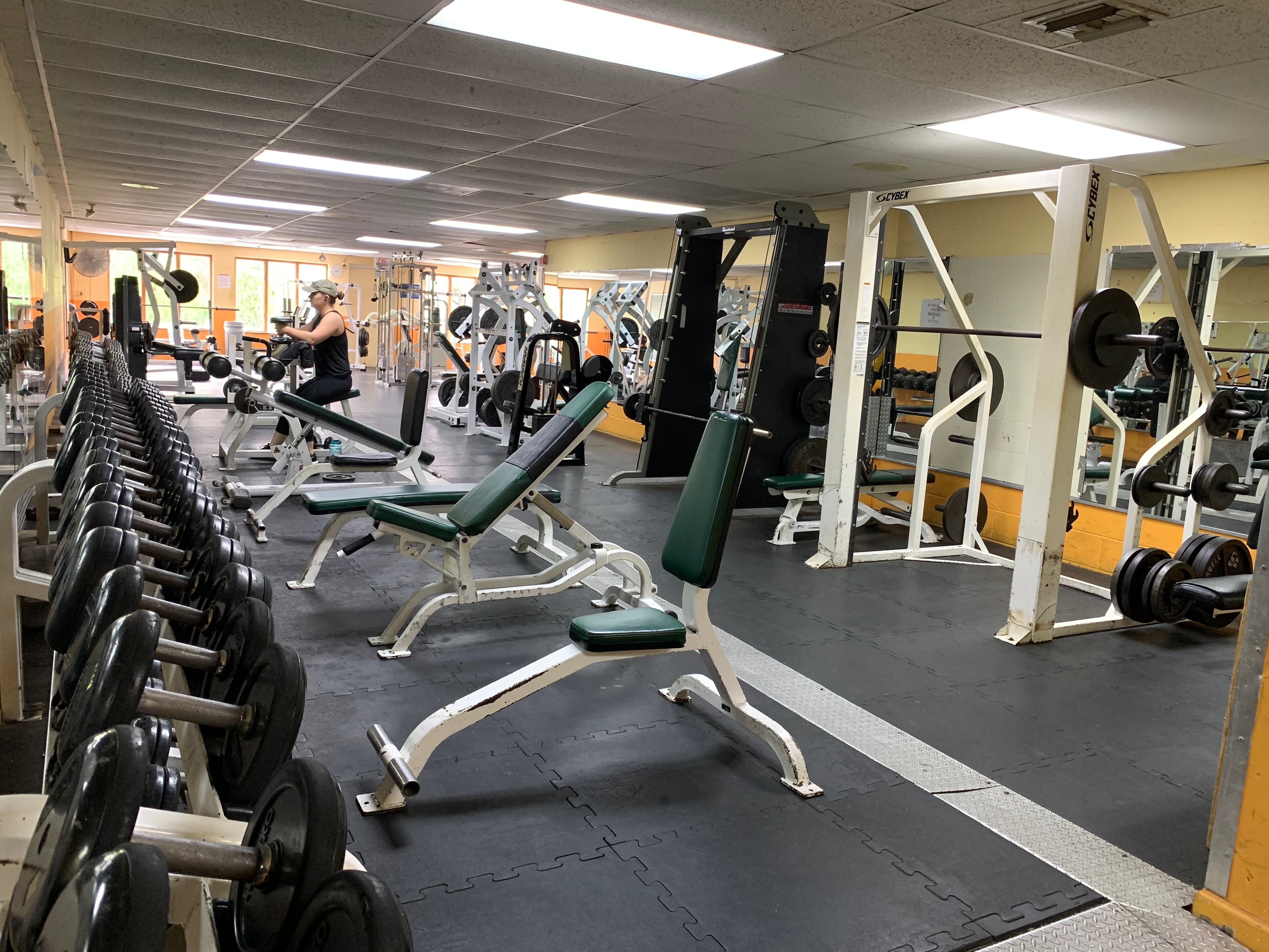 Optimal Gym interior with free weights and training space